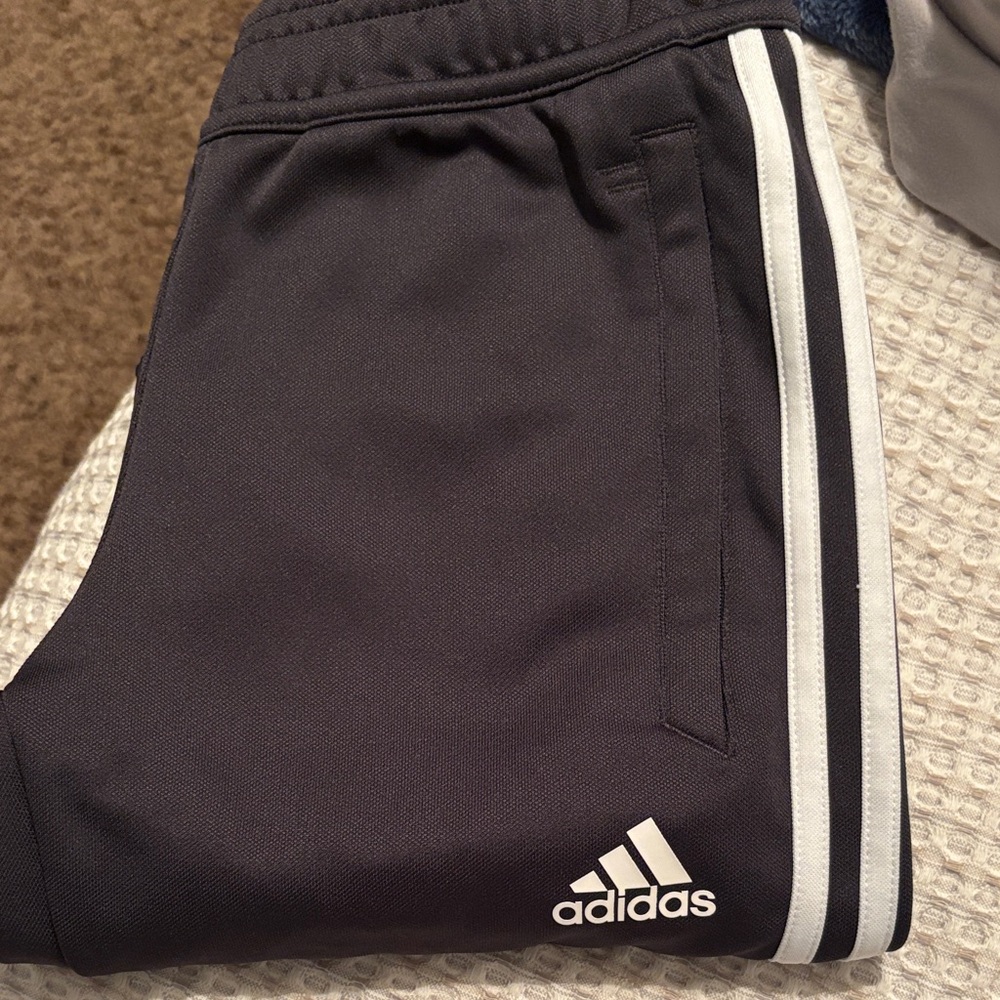 Adidas Charcoal Grey Joggers with White Stripes.